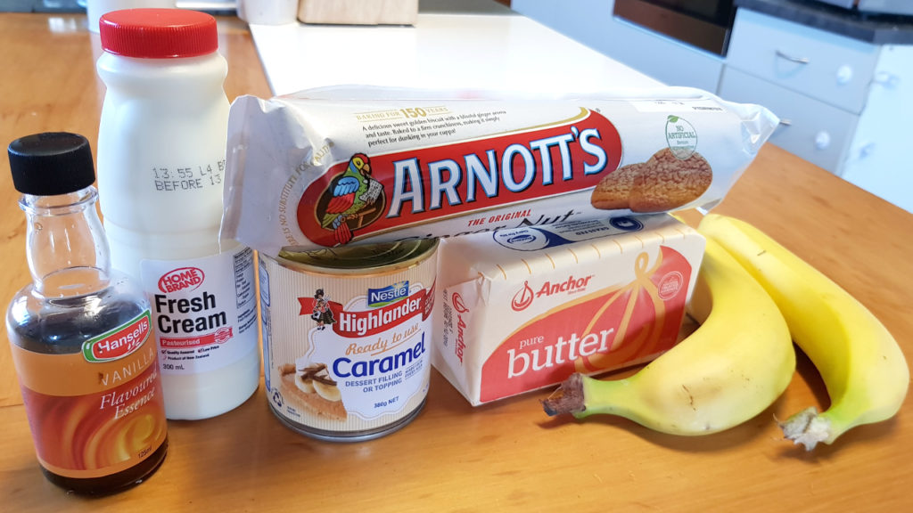 Banoffee Pie ingredients with vanilla essence, cream, caramel condensed milk, gingernuts, butter and bananas